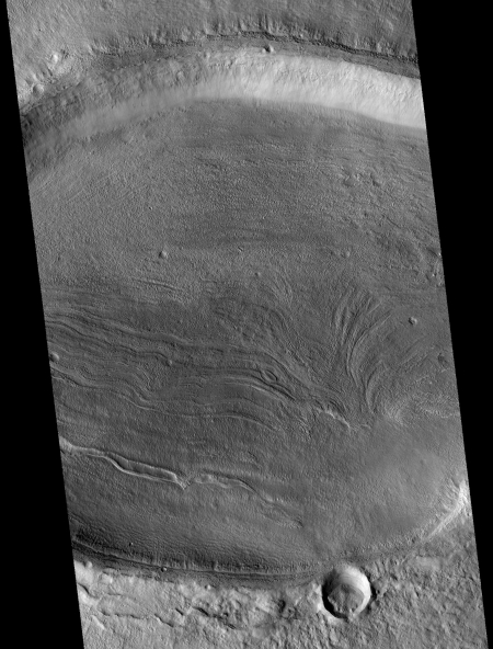 Elliptical crater with flow features