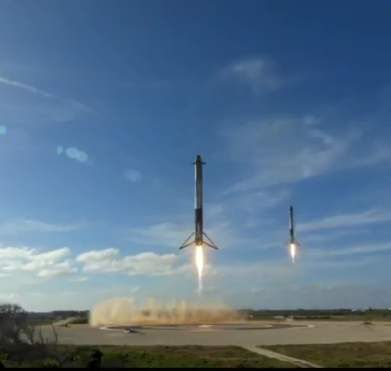 The landing of the two outer first stages during the first Falcon Heavy launch