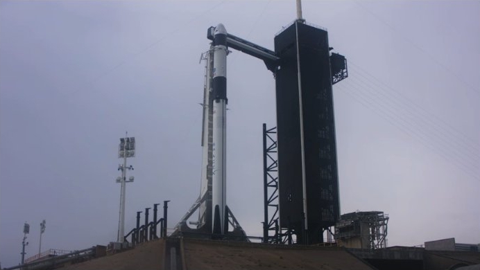 Falcon 9, Dragon, with crew on board, at just under T-2 hours