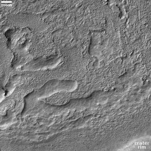Eroded ice in crater near Reull Valles