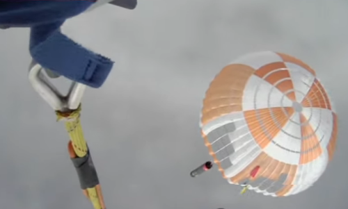 Electron first stage on parachute just before capture