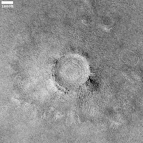 Cracking pedestal crater near Mars' north pole