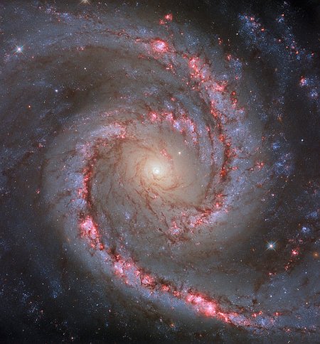A spiral galaxy giving birth to a lot of stars
