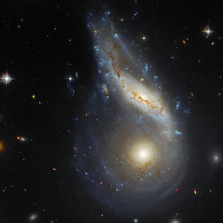 One spiral galaxy eating another