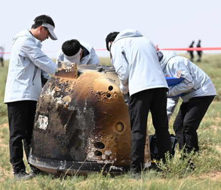 Engineers inspecting and opening Chang'e-6 return capsule