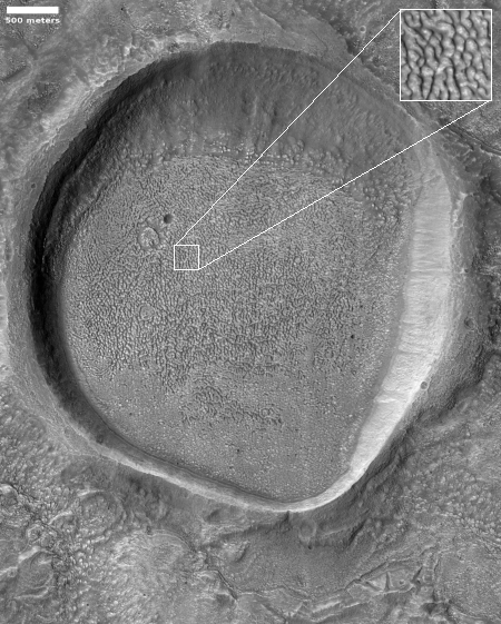 An icy Martian crater filled with brain terrain