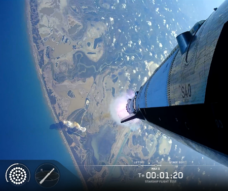 Starship/Superheavy, shortly after launch and looking down at Boca Chica